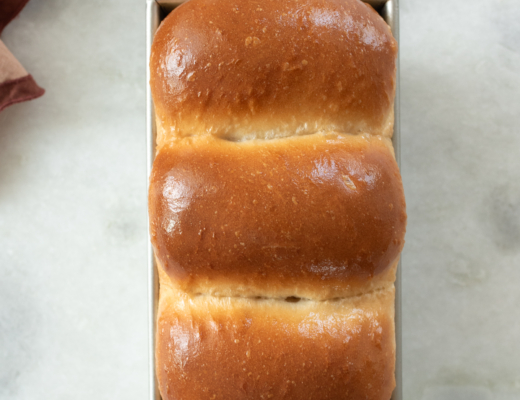 overhead shot of freshly baked sourdough discard sandwich bread loaf