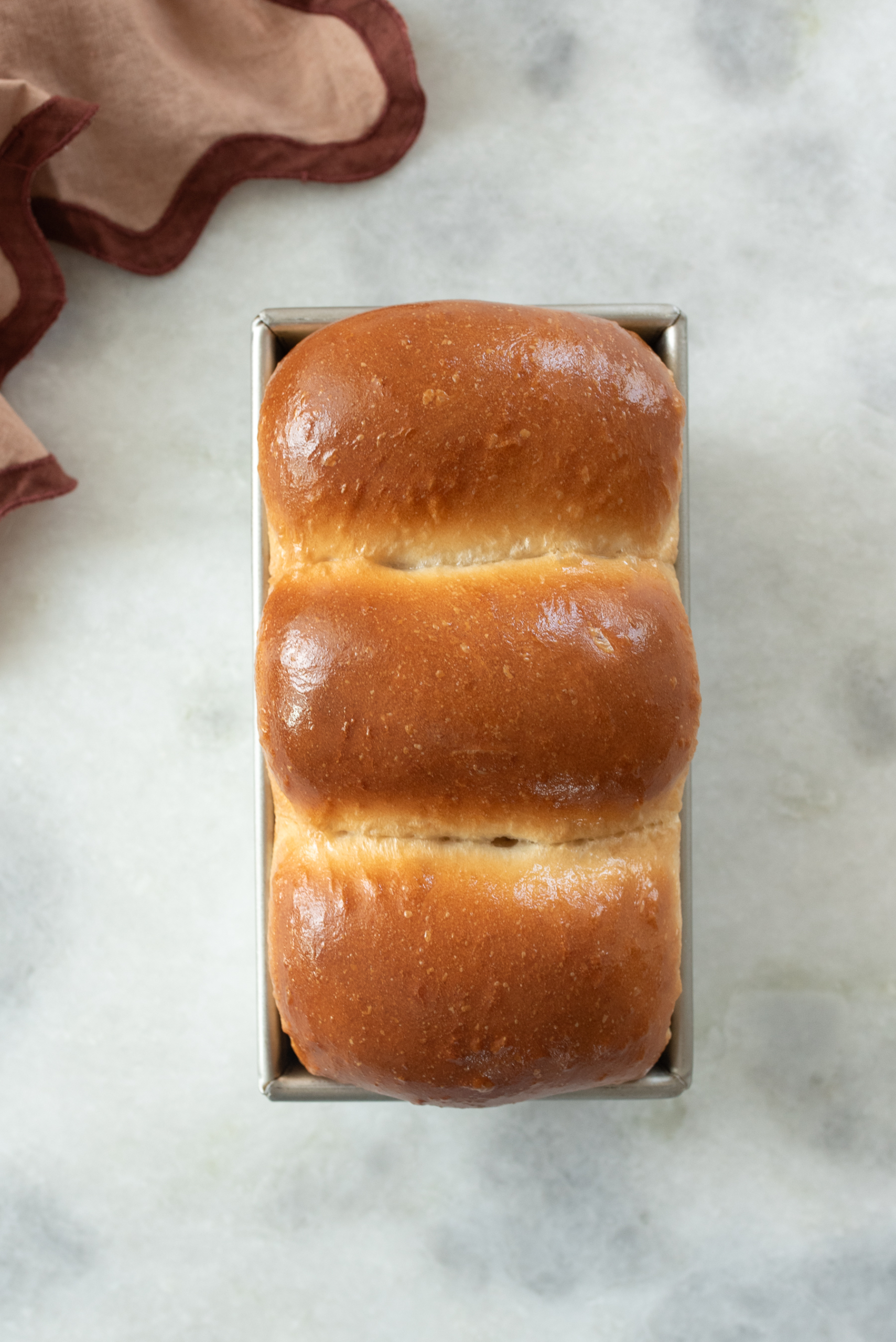 overhead shot of freshly baked sourdough discard sandwich bread loaf